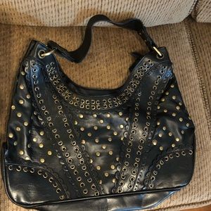 Black bag with brass circles